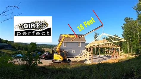 Setting trusses with a excavator and 16 foot jib pole  